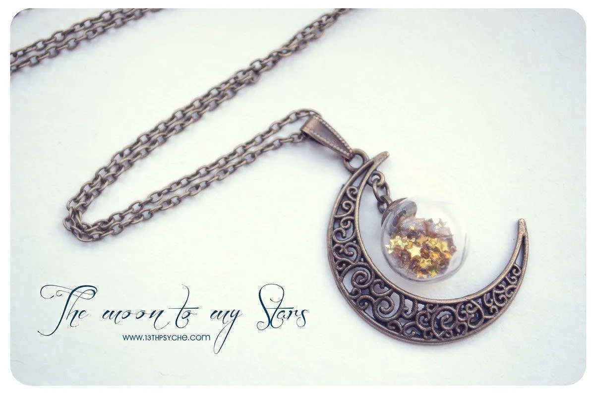 Bronze crescent moon globe necklace with glitter stars