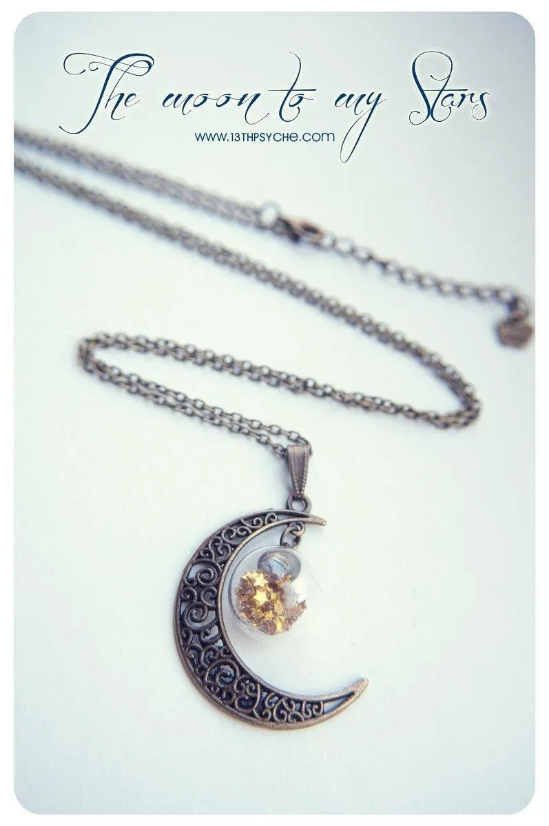 Bronze crescent moon globe necklace with glitter stars